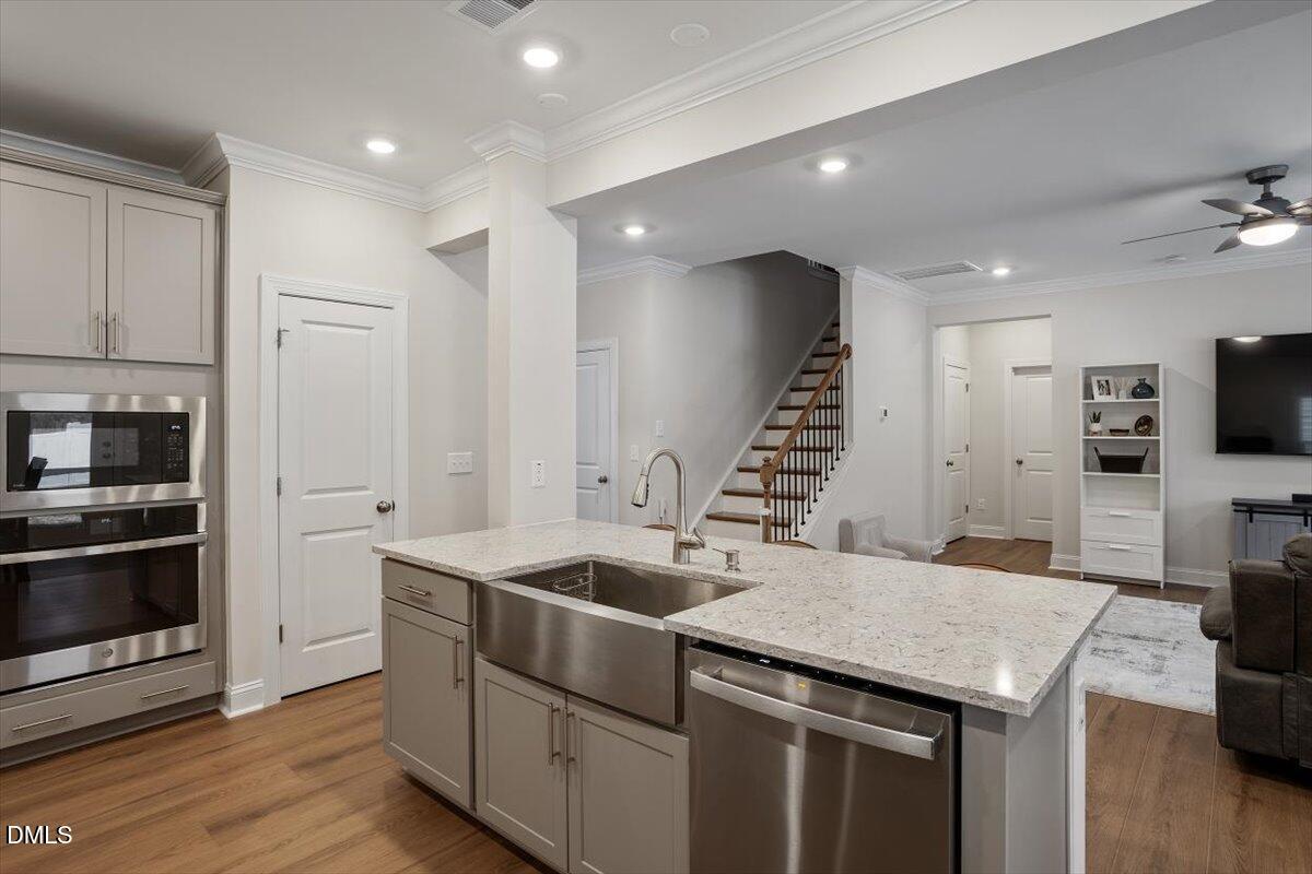 4038 Front Runner Drive Durham, NC 27703 - Photo 19 of 47 a kitchen that has a microwave and a sink