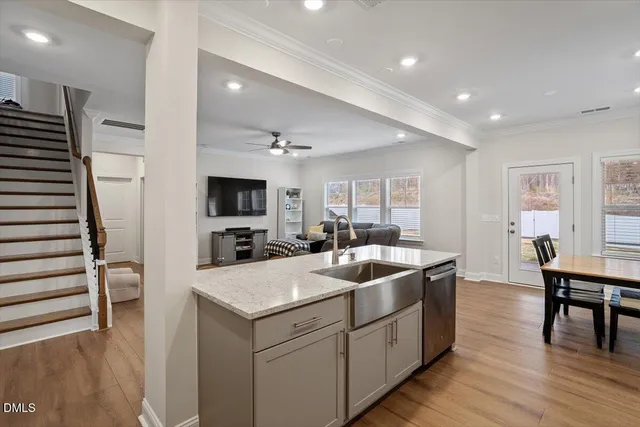 a kitchen that has a sink and a stove in it