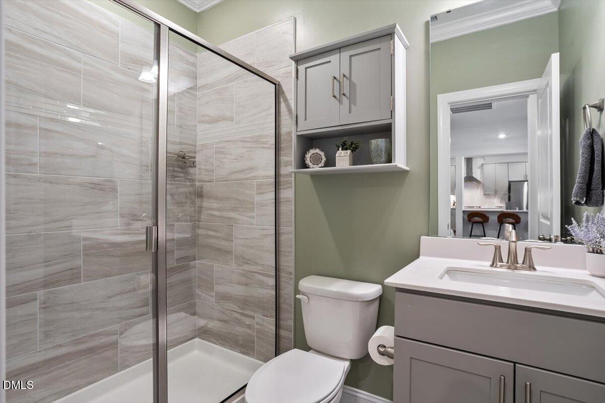 4038 Front Runner Drive Durham, NC 27703 - Photo 24 of 47 a bathroom with a toilet sink and shower