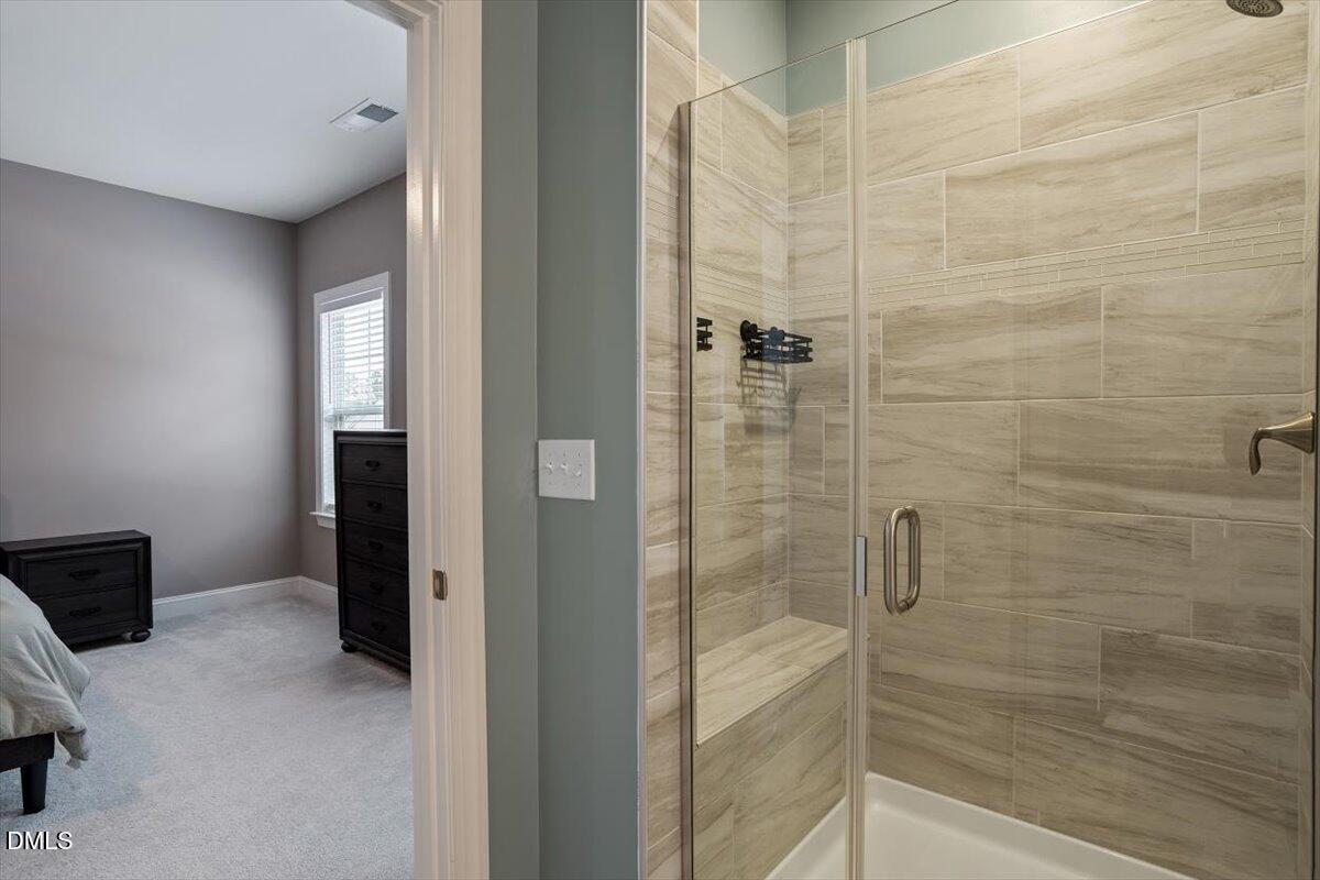 4038 Front Runner Drive Durham, NC 27703 - Photo 30 of 47 a bathroom with a shower
