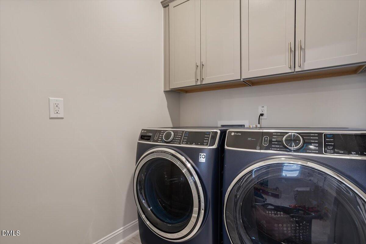 4038 Front Runner Drive Durham, NC 27703 - Photo 37 of 47 a utility room with dryer and washer
