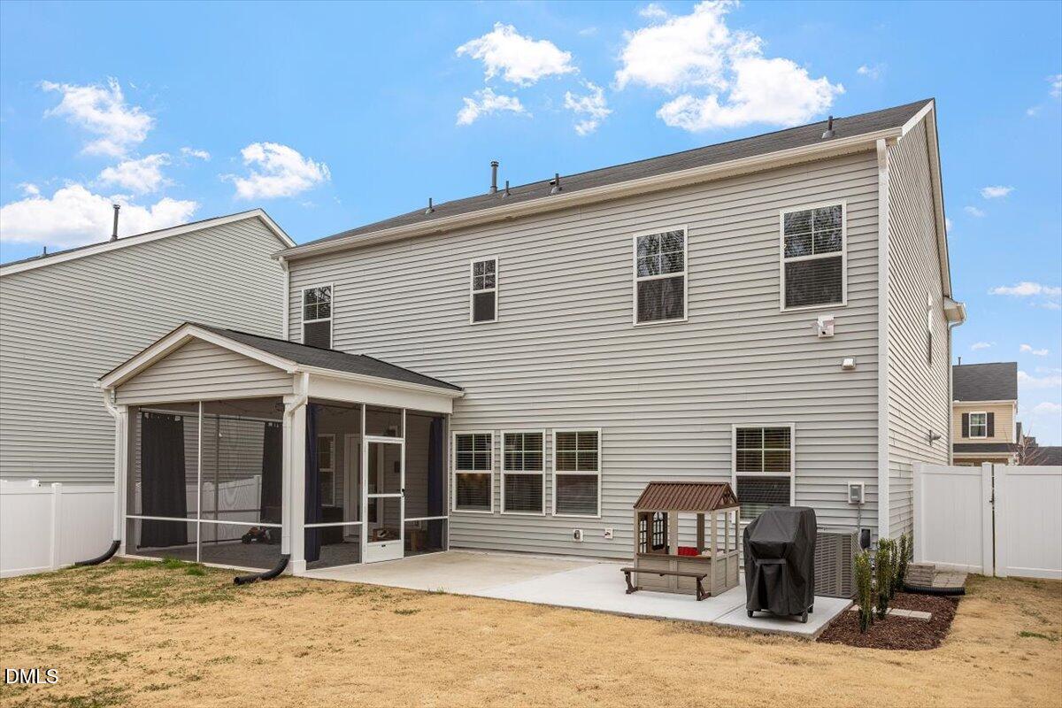 4038 Front Runner Drive Durham, NC 27703 - Photo 40 of 47 a front view of a house with a yard