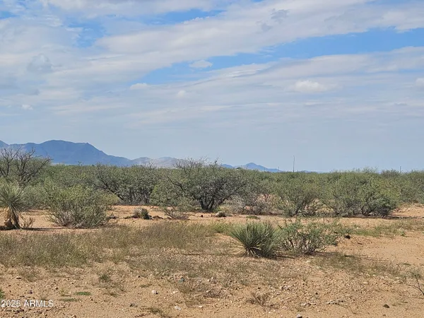 a view of a town with mountains