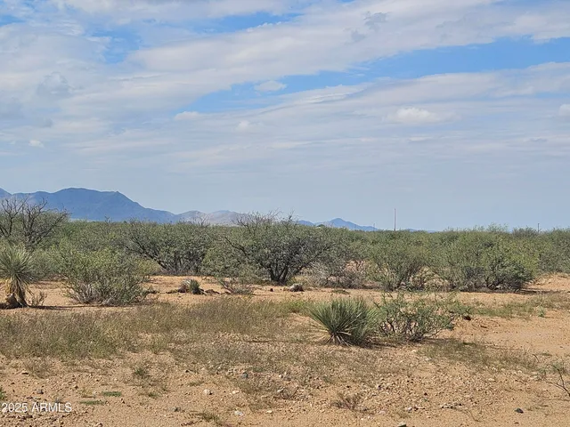 a view of a town with mountains