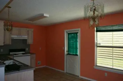 a kitchen with stainless steel appliances a refrigerator and a stove
