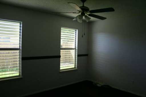 7813 Falcon Drive Corpus Christi, TX 78414 - Photo 5 of 6 a view of an empty room with a window