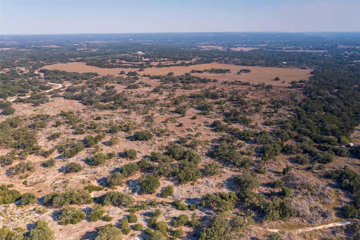 Tbd Lyda Ranch Road Bertram, TX 78605 - Photo 4 of 28 an aerial view of residential house with beach and green space