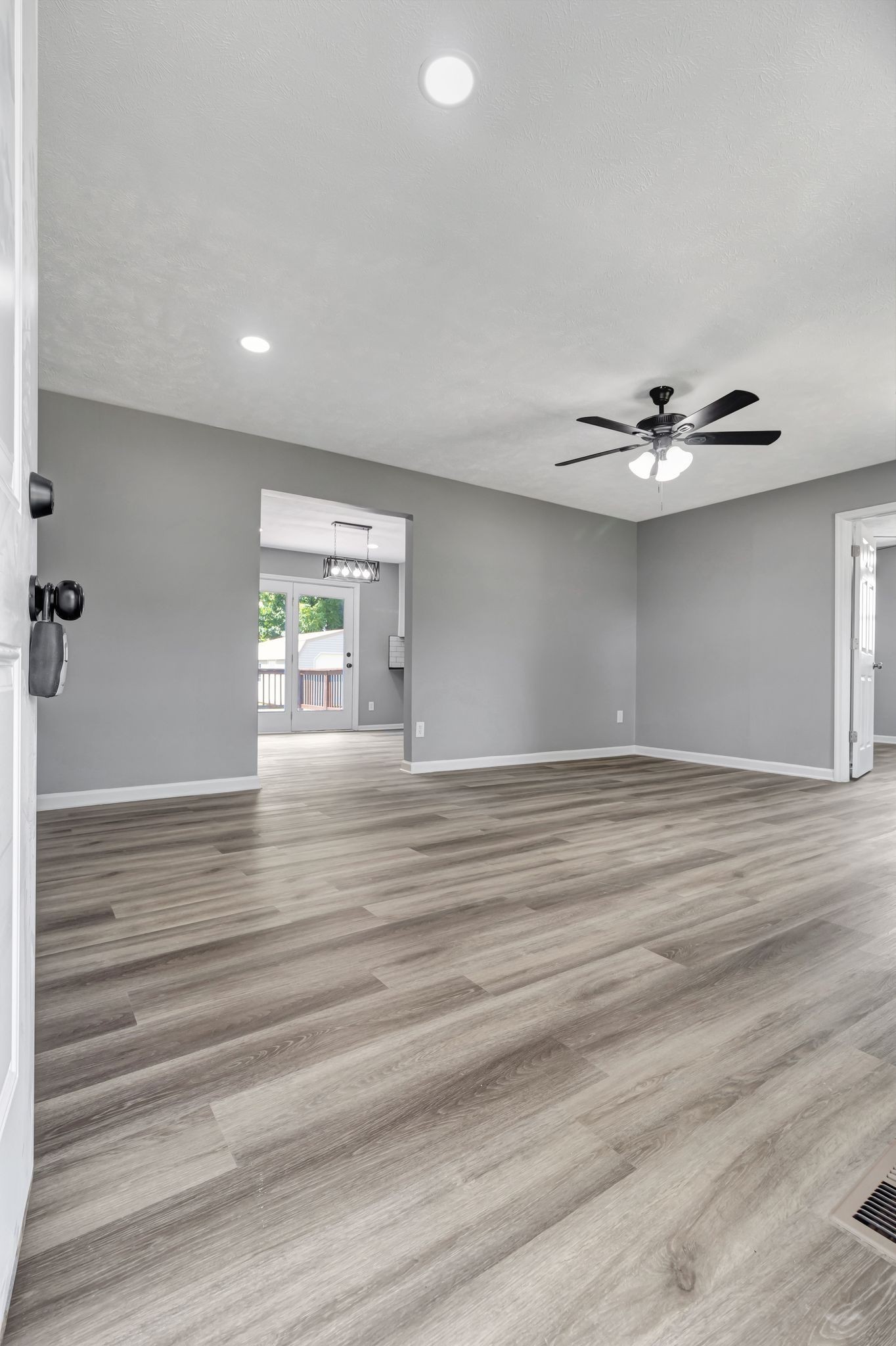 6799 Longview Drive Murfreesboro, TN 37129 - Photo 7 of 30 an empty room with wooden floor and windows