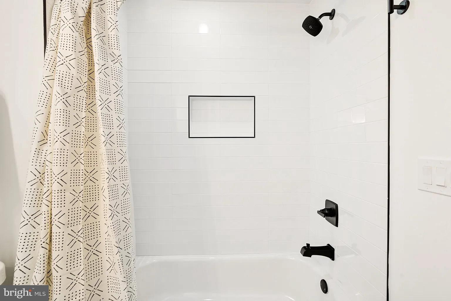 1735 South 23rd Street, Unit 2 Philadelphia, PA 19145 - Photo 13 of 17 a bathroom with a bathtub and shower