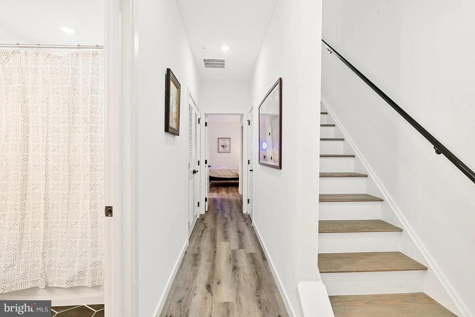 1735 South 23rd Street, Unit 2 Philadelphia, PA 19145 - Photo 15 of 17 a view of a hallway with wooden floor and staircase