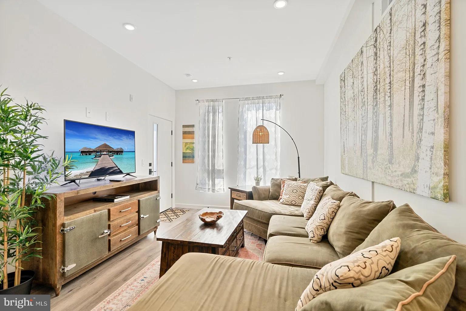 1735 South 23rd Street, Unit 2 Philadelphia, PA 19145 - Photo 2 of 17 a living room with furniture and a flat screen tv