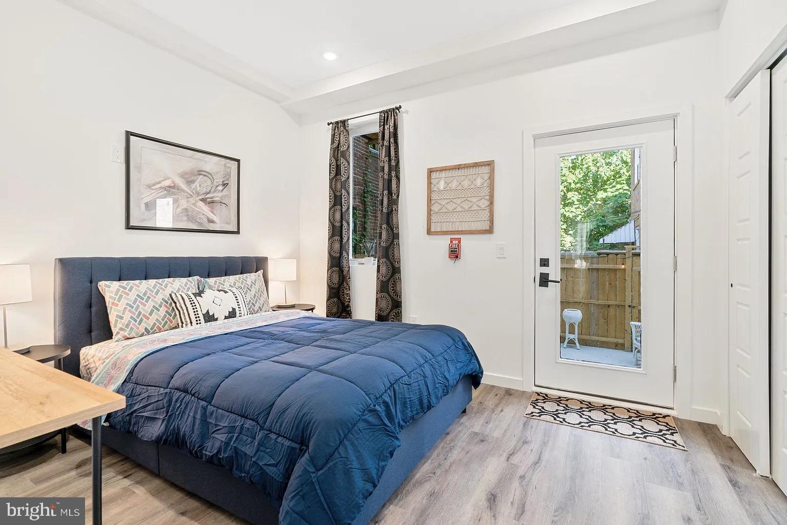 1735 South 23rd Street, Unit 2 Philadelphia, PA 19145 - Photo 8 of 17 a bedroom with a bed and a window