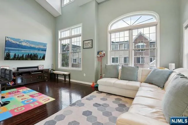 a living room with furniture and a rug