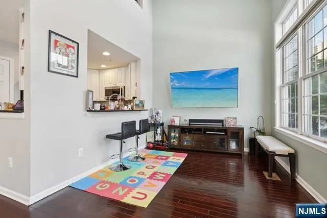 a kitchen with stainless steel appliances granite countertop a refrigerator stove and sink