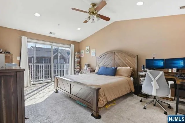 a bathroom with a double vanity sink mirror and bathtub