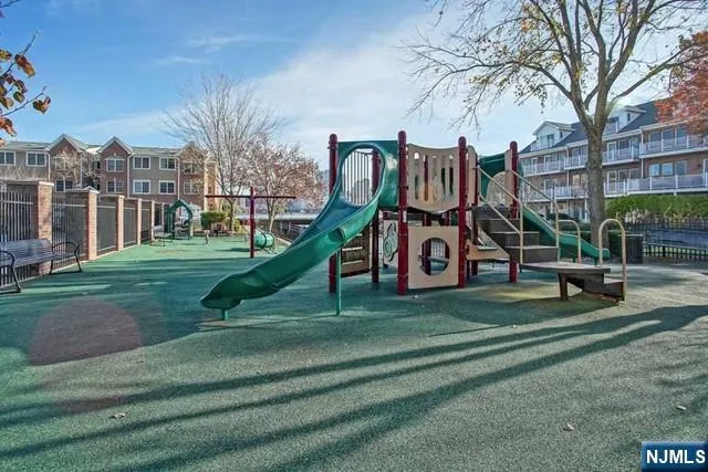 a view of a park with large trees