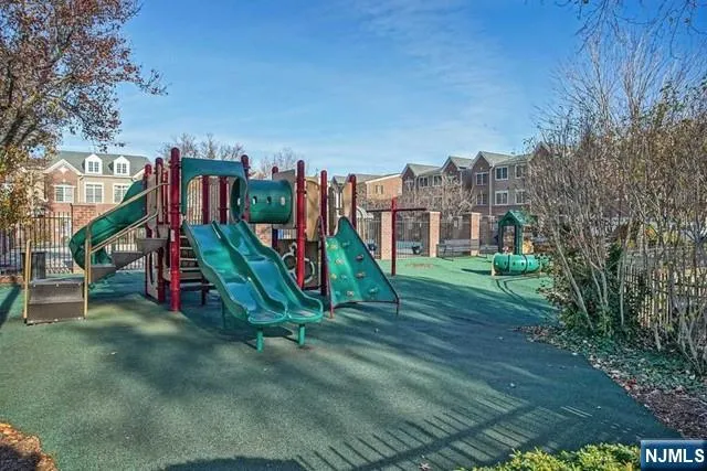 a view of a chairs and table in front of a house