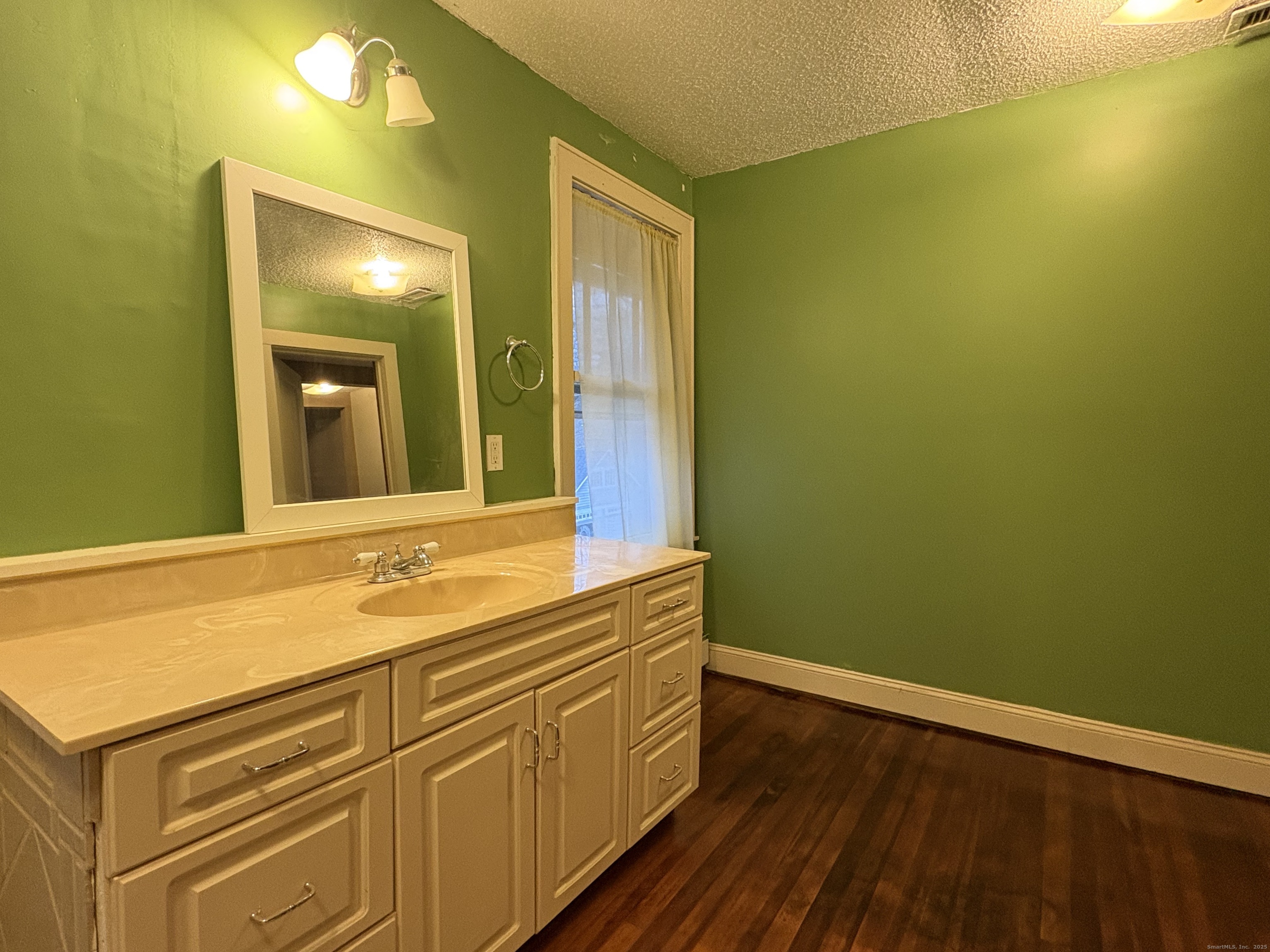 173 Leesville Road Moodus, CT 06469 - Photo 17 of 17 a bathroom with a sink and a mirror