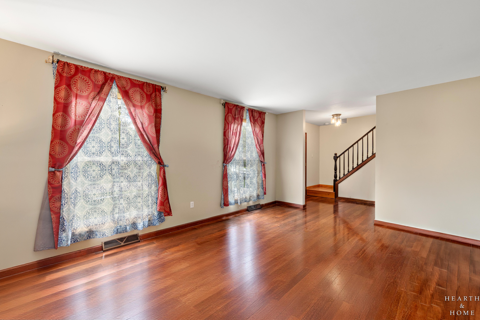506 Old Hunt Road Fox River Grove, IL 60021 - Photo 6 of 44 a view of an empty room with wooden floor and stairs