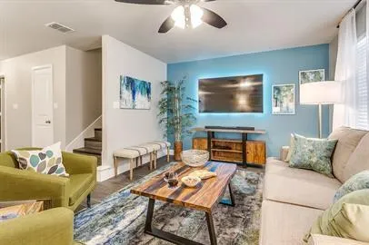 a living room with furniture and a flat screen tv