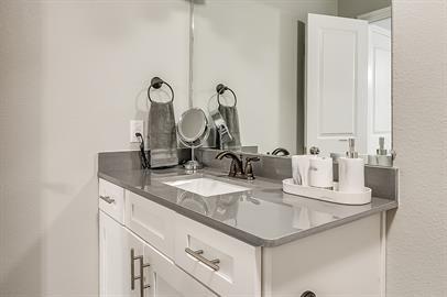 4021 Sheraton Road Denton, TX 76209 - Photo 29 of 35 a bathroom with a sink and a mirror