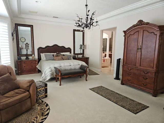 a bedroom with furniture and wooden floor