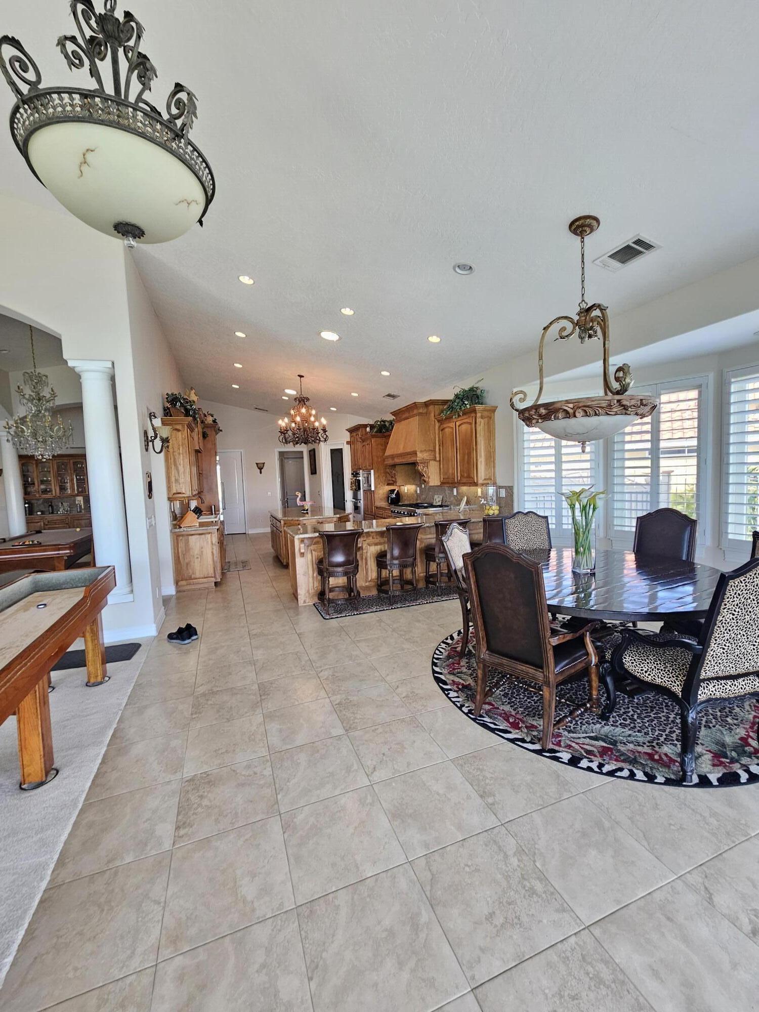 26461 Edgewater Lane Helendale, CA 92342 - Photo 9 of 24 a living room with furniture a dining table and kitchen view