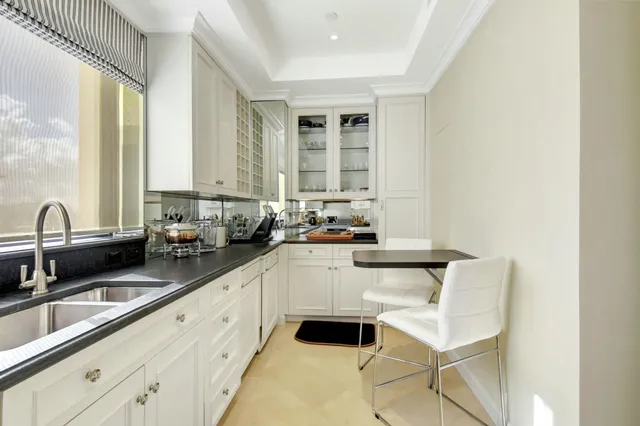 a view of a swimming pool with lawn chairs