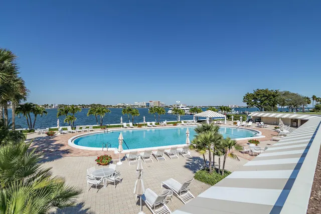 an aerial view of residential houses with outdoor space and swimming pool