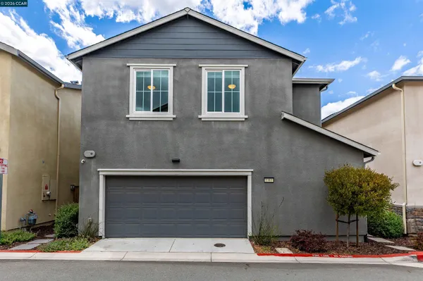 a front view of a house with garage