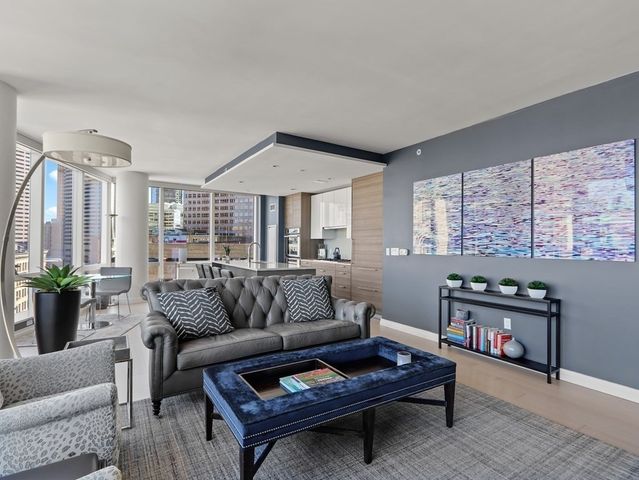 a living room with furniture and a rug