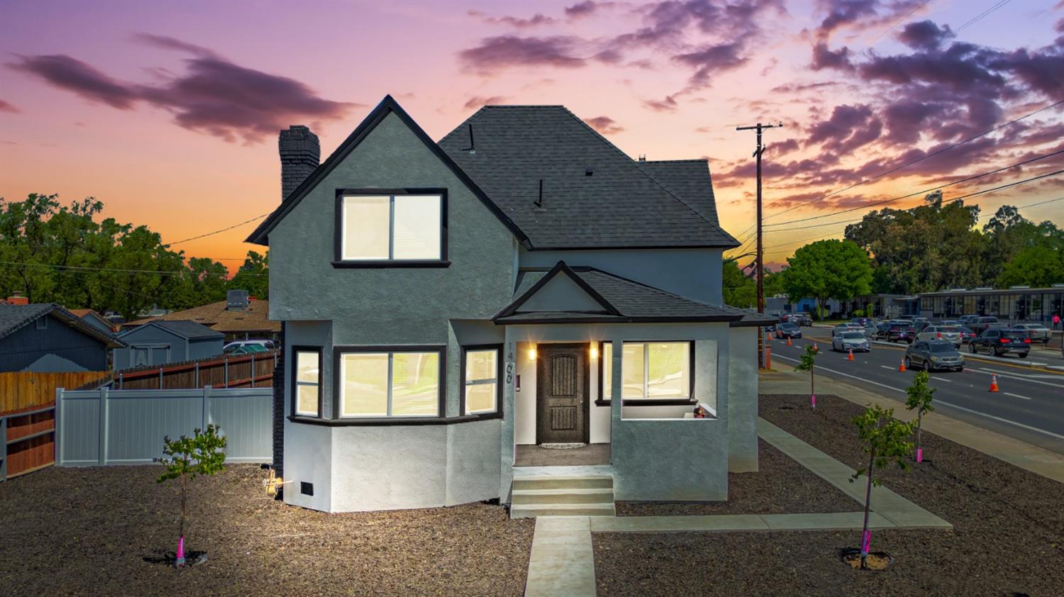 a front view of a house with a yard