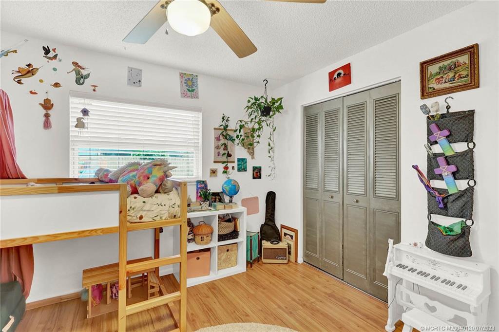 1790 Southeast Madison Street Stuart, FL 34997 - Photo 17 of 24 a dining room with furniture entryway and wooden floor