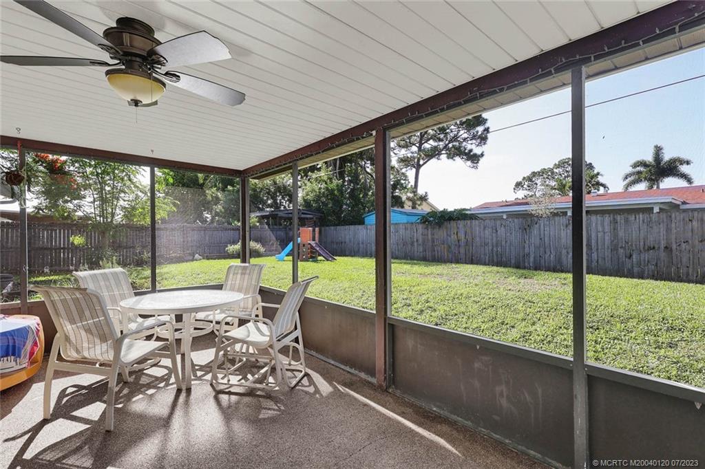 1790 Southeast Madison Street Stuart, FL 34997 - Photo 20 of 24 a living room with patio