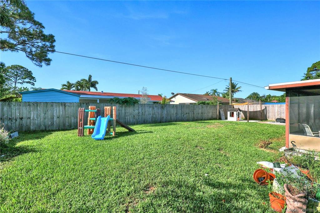 1790 Southeast Madison Street Stuart, FL 34997 - Photo 22 of 24 a view of a backyard