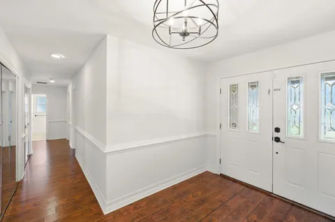 a view of room with wooden floor