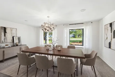 a dining room with furniture and window