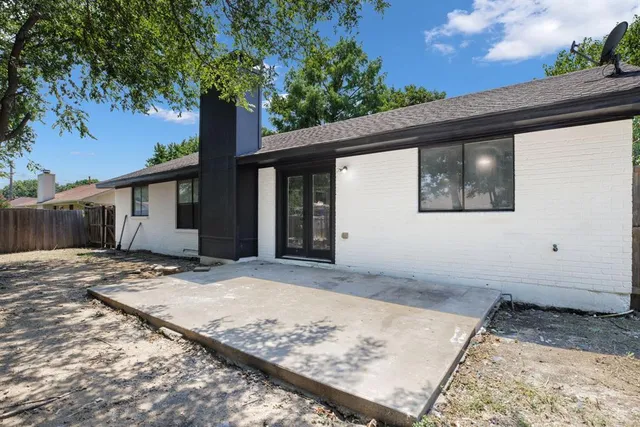 a view of a house with a snow on the road