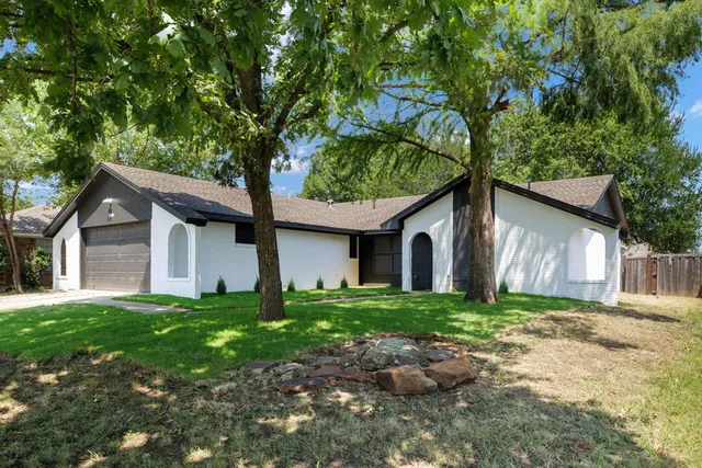 a house with a tree in front of it