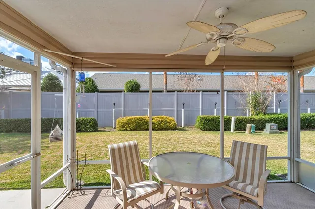 a view of an outdoor dining space with a table and chairs