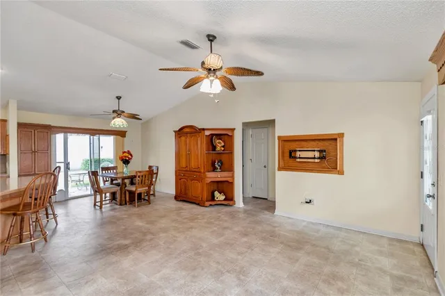 a view of a dining room with furniture window and outside view