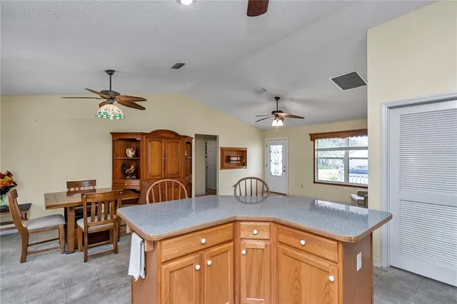 a kitchen with a stove and a refrigerator