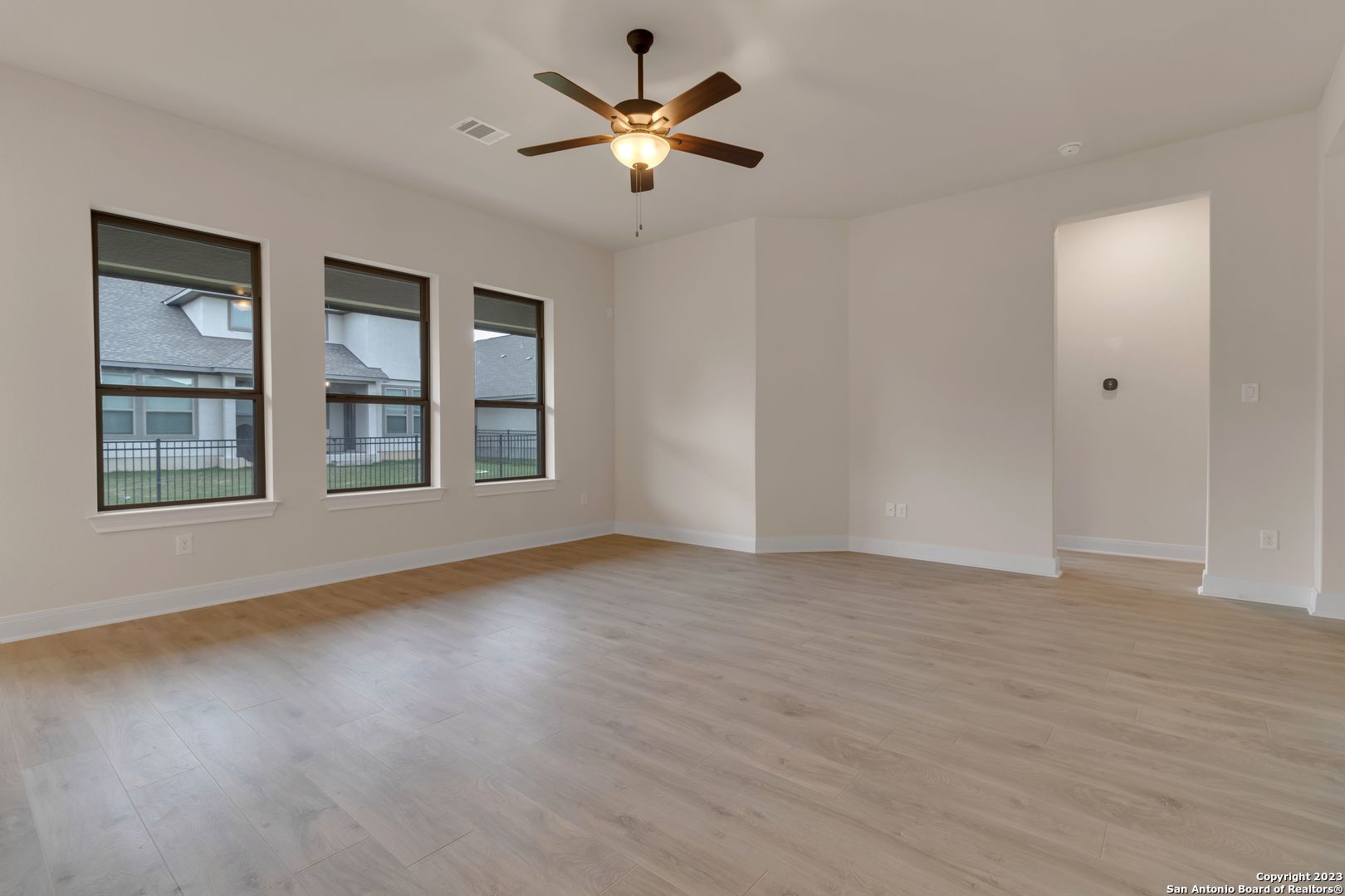 107 Matador Boerne, TX 78006 - Photo 13 of 35 a view of an empty room with window and wooden floor