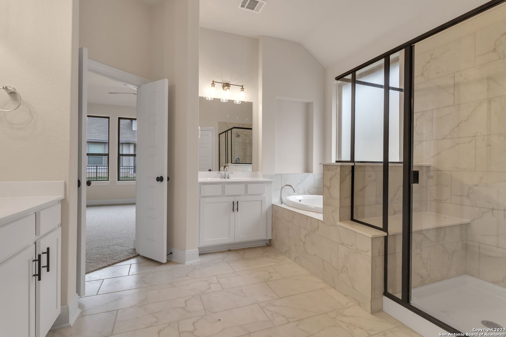 107 Matador Boerne, TX 78006 - Photo 33 of 35 a bathroom with a shower sink and mirror