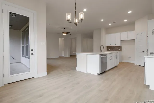 a view of a kitchen with a sink cabinets and window