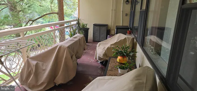 a balcony view with chairs