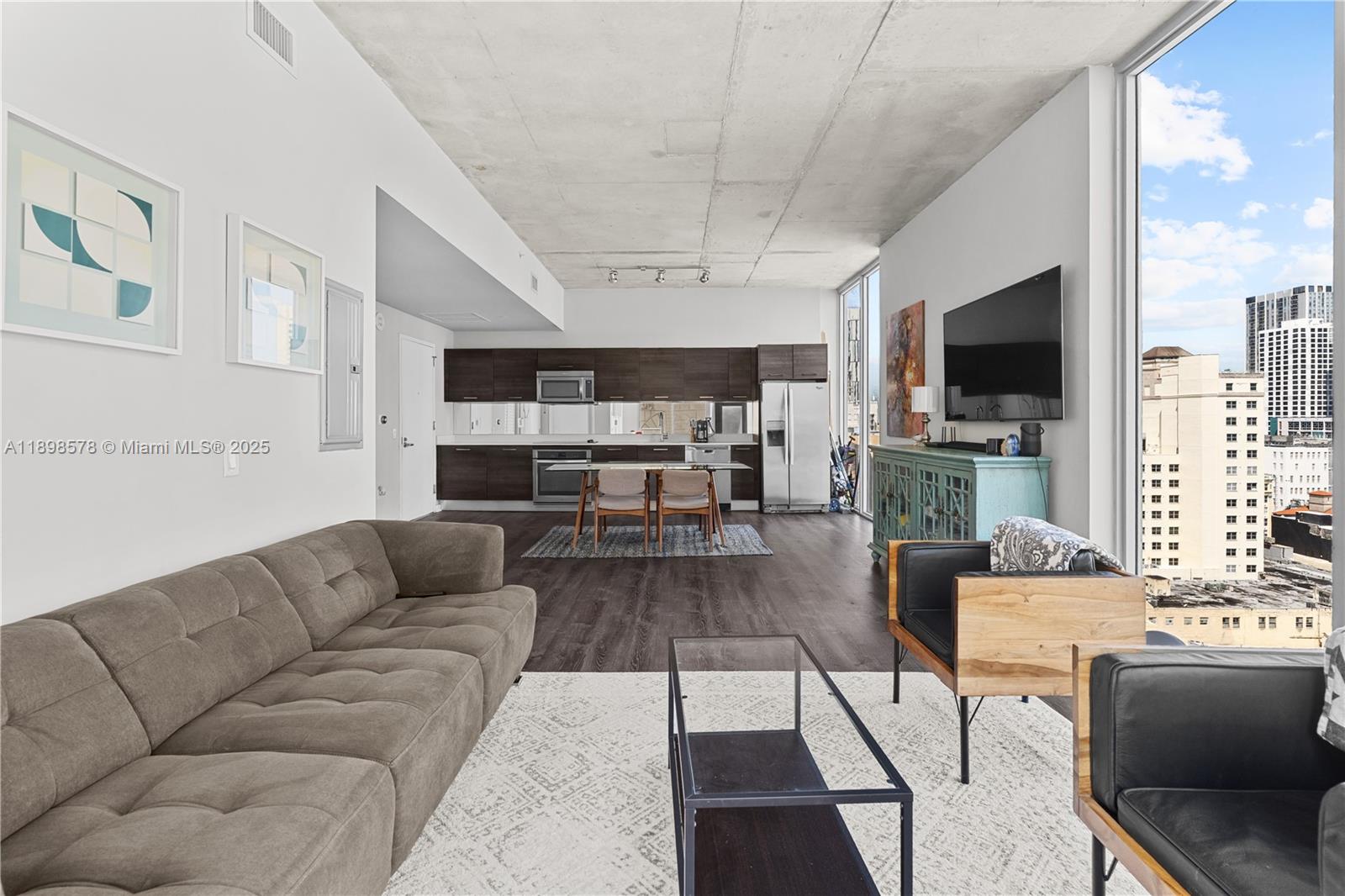 a living room with furniture and a flat screen tv