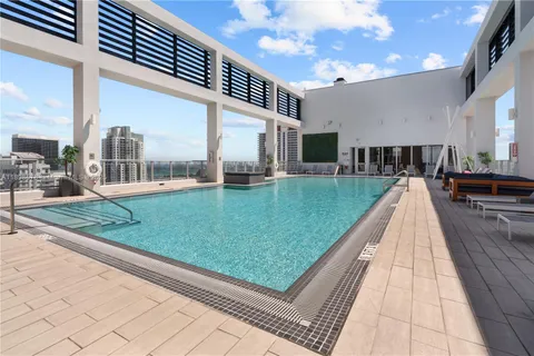 a view of a backyard with sitting area