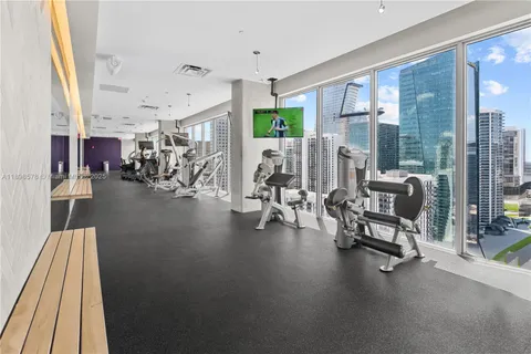 a view of a livingroom with couch and a large window
