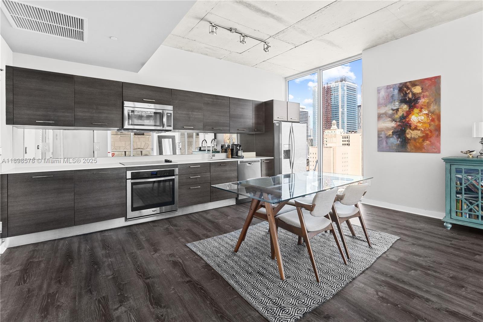 151 Southeast 1st Street, Unit 1402 Miami, FL 33131 - Photo 2 of 16 a view of a dining room with furniture and window